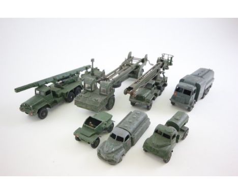 Eight play worn Dinky military vehicles including Missile Launcher, Missile Erector, petrol Tanker, Scout car, Army water Tan