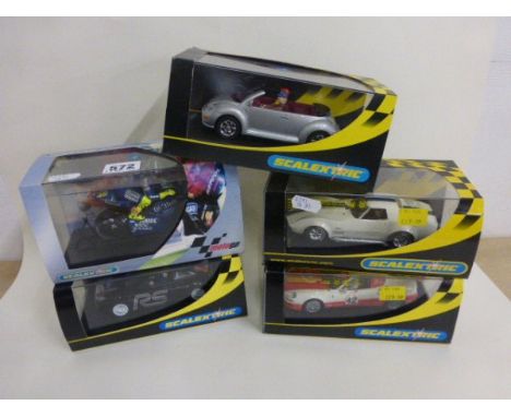 Four boxed/cased Scalextric slot cars including C2402 Ford Mustang '69 No 16, C2314 VW Beetle silver, C2575 Chevrolet Corvett