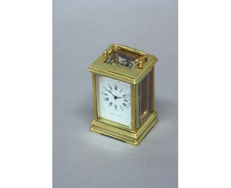 A CARRIAGE TIMEPIECE dial white enamel, signed Racine & Co., movement lever escapement, 4 1/4ins. (11cms.) high