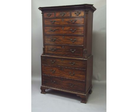 A GEORGE III MAHOGANY TALLBOY the upper part with an egg and dart and key pattern cornice, fitted with three short drawers ab