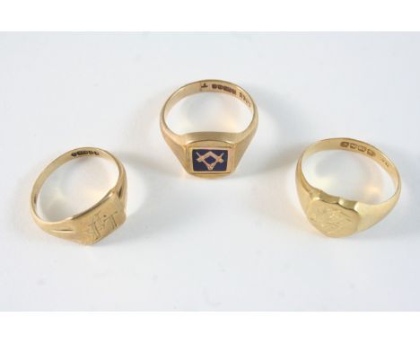 A GOLD AND ENAMEL MASONIC SWIVEL RING one side set with blue enamel, the other engraved with initials, in 9ct. gold, size T, 