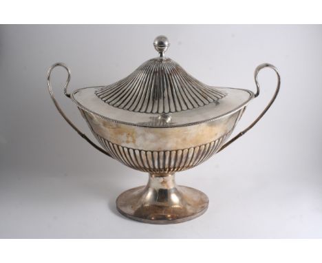AN OLD SHEFFIELD PLATED SOUP TUREEN boat-shaped with part-fluting, twin loop handles & a domed cover with a ball finial, unma