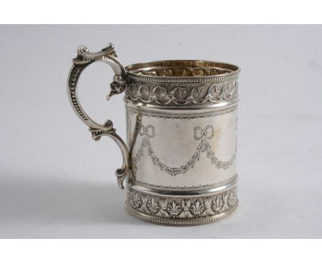 A VICTORIAN EMBOSSED MUG cylindrical with an upper & lower frieze, bead borders & engraved floral festoons with tied ribbons 