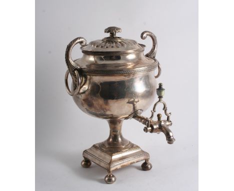 A SMALL EARLY 19TH CENTURY PLATED TEA URN on a square pedestal base with button feet, upswept handles & a spigo with an ivory