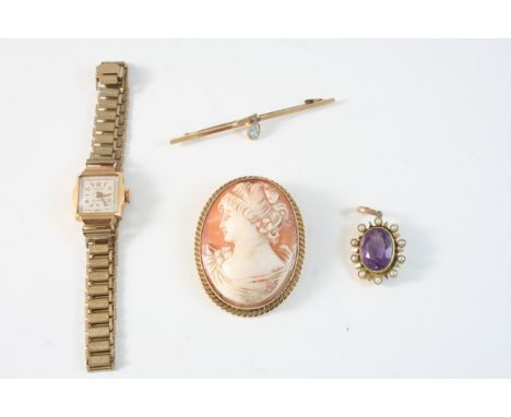 A LADY'S 18CT. GOLD WRISTWATCH on a rolled gold bracelet, together with a carved shell cameo brooch, and amethyst and seed pe