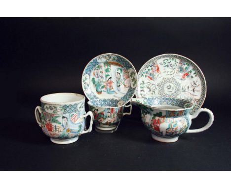 A CANTONESE FAMILLE ROSE PART TEA SERVICE each piece painted with figures outside pavilions, comprising: milk jug, sugar box,