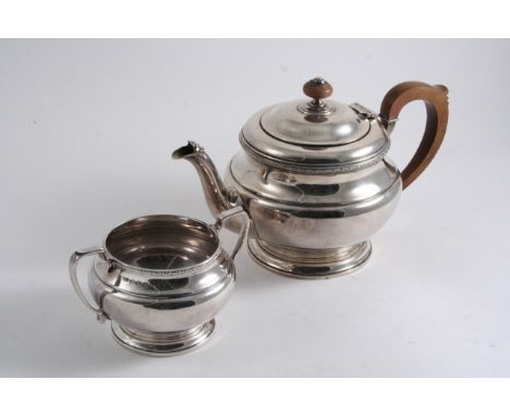 A MODERN CIRCULAR TEA POT & MATCHING SUGAR BASIN maker's mark "BS", Birmingham 1931;  the pot 6.2"  (15.5 cms) high; 30 oz  (