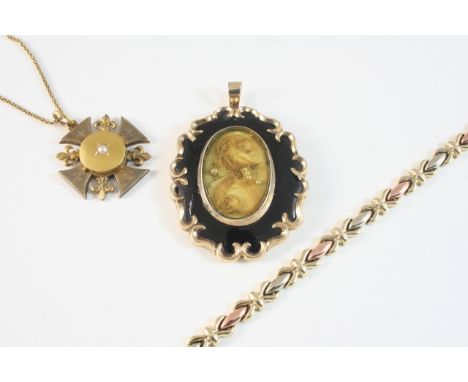 A VICTORIAN BLACK ENAMEL AND GOLD MOURNING LOCKET PENDANT the centre section containing hair, 5 x 4cm, together with a 9ct. t