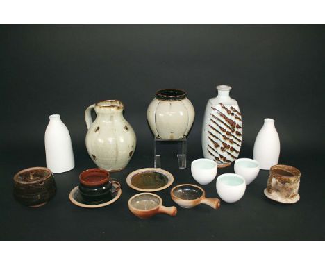 STUDIO POTTERY a large lot including a Winchcombe Cup and two saucers, two Lowerdown dishes, John Jelfs celadon vase, Peter S