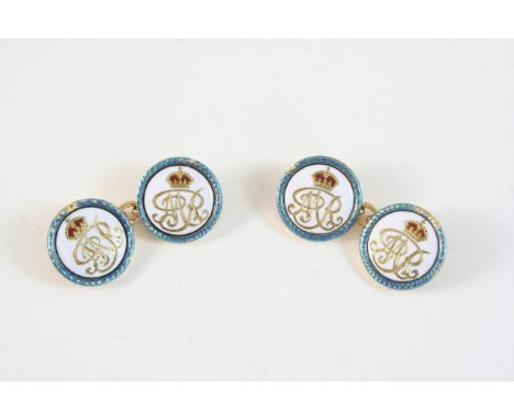 A PAIR OF ENAMEL AND GOLD CUFFLINKS BY BENZIE OF COWES of circular shape, the white enamel centre with gold initials MR below