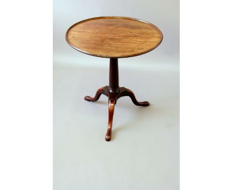 A GEORGE III MAHOGANY TRIPOD TABLE the circular top now dished, on a birdcage base, 25ins. (63.5cms.) dia.