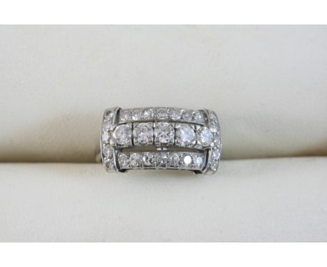 A DIAMOND CLUSTER RING set with graduated circular-cut and single-cut diamonds. Size K 1/2.