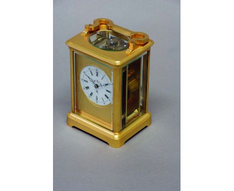 A CARRIAGE TIMEPIECE dial white enamel, delicately painted with a floral garland, set on an engine-turned ground, movement le