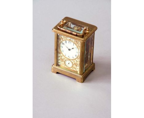 A CARRIAGE CLOCK dial cream enamel, with subsidiary alarum dial, overlaid with bright-cut floral and foliate scrolls, movemen