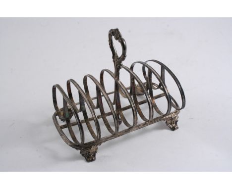 A VICTORIAN TOAST RACK with seven reeded bars & a central handle, bracket feet by William Evans, London 1864;  6.7"  (16.8 cm