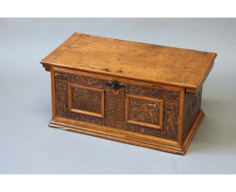 A 17TH CENTURY NORTH ITALIAN CYPRESS TRUNK the front with two panels incised and inked with classical figures and flanked by 