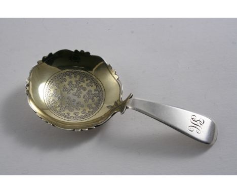 A GEORGE III CADDY SPOON with an engraved, shaped circular gilt bowl, initialled "GH", by Edward Fairbrother, London 1812;  4