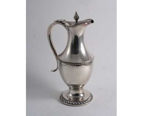 AN EARLY PERIOD OLD SHEFFIELD PLATED EWER OR JUG of vase form with a gadrooned foot, bead borders & a bud finial, inset woode