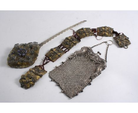 A MIXED LOT: A 19th century silvergilt & filigree work piece (perhaps a cloak clasp or ornament), six panels from a belt, and