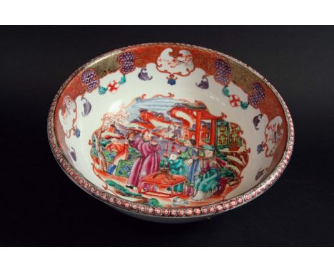 A BASIN the interior painted in the Mandarin palette with figures and a hawk, on a lakeside terrace, within elaborate scrolle