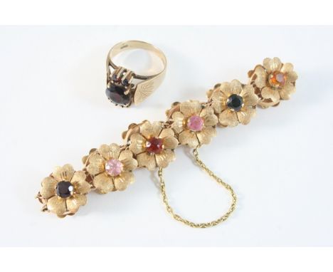 AN 18CT. GOLD FOLIATE BRACELET each flowerhead set with a circular-cut gemstone, including tourmaline, rose quartz, citrine, 