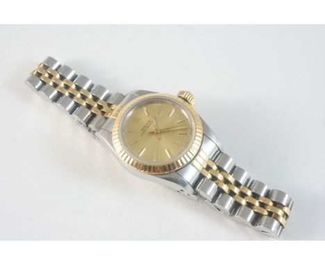A LADY'S STAINLESS STEEL AND GOLD OYSTER PERPETUAL WRISTWATCH BY ROLEX the signed gold coloured dial with baton numerals, and