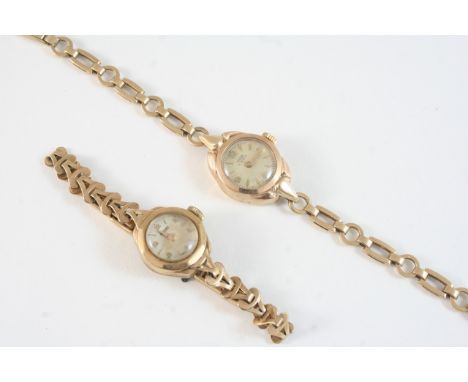 A LADY'S 9CT. GOLD WRISTWATCH BY ROTARY the signed circular dial with Arabic and baton numerals, on a gold bracelet with ladd
