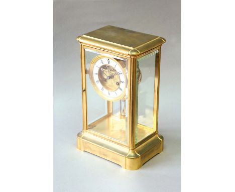 AN ORMOLU FOUR GLASS CLOCK dial white enamel, with exposed escapement and foliate engraved plate behind, movement drum, mercu