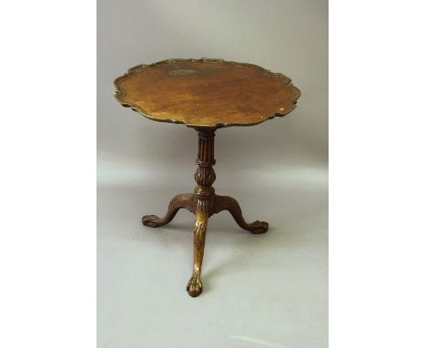A GEORGE III MAHOGANY TRIPOD TABLE with a dished piecrust top and birdcage support 26 1/2ins. (67cms.) dia. Alterations