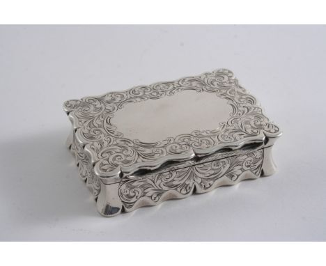 A VICTORIAN ENGRAVED SNUFF BOX  of shaped oblong outline with concaved sides, a vacant cartouche on the cover & gilt interior