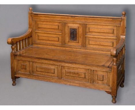 ARTS & CRAFTS SETTLE/MONKS BENCH an interesting oak settle with a lift up seat and carved initials in the back, CCJ. The top 