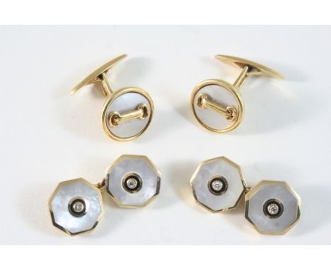 A PAIR OF MOTHER-OF-PEARL, BLACK ENAMEL AND DIAMOND CUFFLINKS each octagonal mother-of pearl link centred with a small diamon