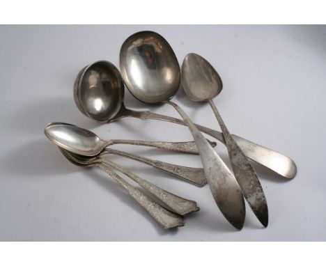 A MIXED LOT: A set of four early 20th century American table spoons, initialled, by Tiffany & Co., a Russian soup ladle, Fidd