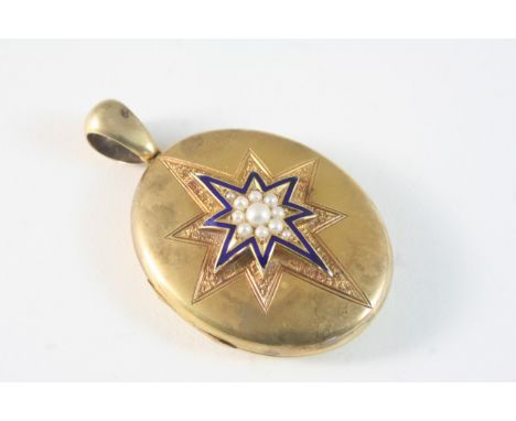 A VICTORIAN GOLD LOCKET PENDANT of oval shape, the front case with engraved and applied star decoration set with blue enamel 
