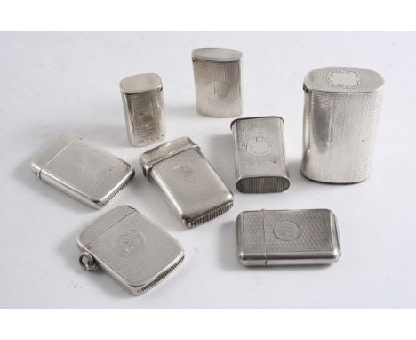 EIGHT VARIOUS VESTA CASES with engine-turned decoration (some initialled), one crested & one with a suspensory ring), mixed m