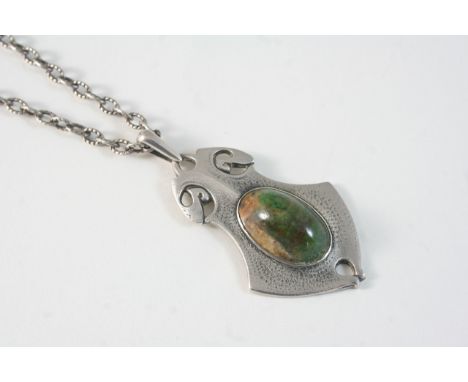 AN ART NOUVEAU SILVER AND TURQUOISE PENDANT BY WILLIAM H. HASELER set with an oval shaped turquoise cabochon, hallmarked for 