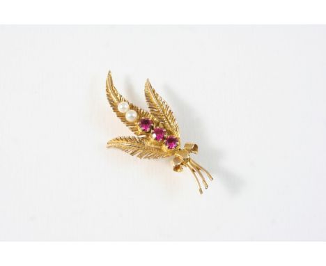 A RUBY AND CULTURED PEARL FOLIATE BROOCH set with three circular-cut rubies and two pearls, in 9ct. gold, 4.5cm. long.
