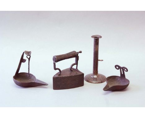 A COLLECTION OF IRON WARE including a box flat iron, two hanging oil lanterns and a candlestick with push-up ejector