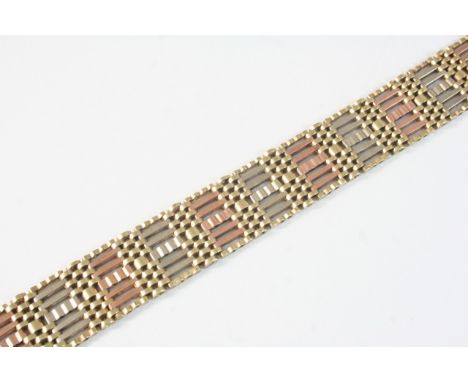 A 9CT. TWO COLOUR GOLD DOUBLE GATE LINK BRACELET with concealed clasp, 18.5cm. long, 26 grams.