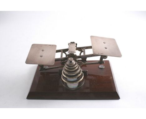 A SET OF SILVER & PLATED LETTER SCALES with six plated weights on wood base 18 cms, retailed by Asprey, silver c.1900 by G. B