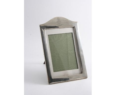 REGIMENTAL INTEREST: A rectangular photograph frame with an arched top, engraved with the badge of the "West Riding Regiment"
