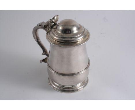 A GEORGE II TANKARD of squat baluster form with an applied reeded girdle & a domed cover, by R. Gurney & T. Cooke, London 175