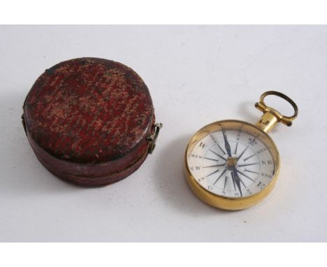 AN EARLY 19TH CENTURY GILT METAL POCKET COMPASS the white enamelled dial with black, Roman lettering, red Morocco leather cas