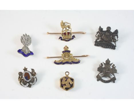 A GOLD AND ENAMEL REGIMENTAL BROOCH FOR THE ROYAL ARTILLERY 5cm. long, pin missing, together with a gold and enamel brooch fo