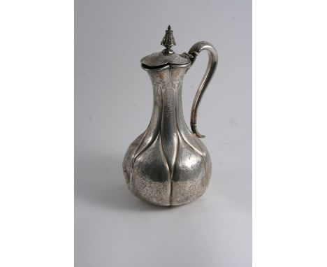 A VICTORIAN ENGRAVED HOT WATER JUG OR EWER of baluster form with engraved & fluted decoration, scroll handle & large knop fin