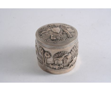 A LATE 19TH CENTURY INDIAN EMBOSSED CYLINDRICAL BOX & COVER, very low grade, with native scenes (including a snake charmer) o