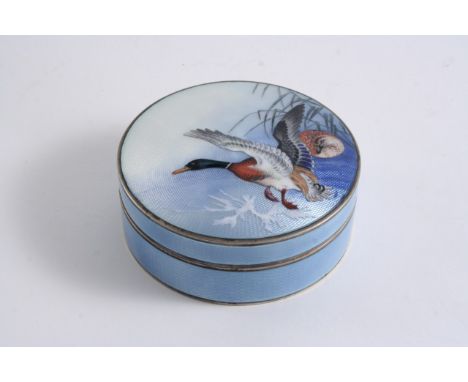 A CONTINENTAL SILVERGILT & ENAMELLED CIRCULAR BOX decorated around the sides in translucent pale blue over an engine-turned g