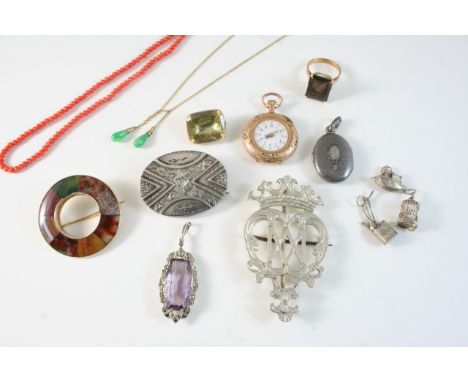 A QUANTITY OF JEWELLERY including a Scottish agate brooch, a lady's gold fob watch, a gold chain with two jade drops, and var