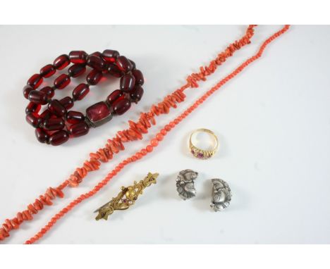 A QUANTITY OF JEWELLERY including a single row graduated coral bead necklace, another coral necklace, a ruby and diamond ring