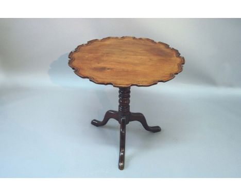 A GEORGE III MAHOGANY TRIPOD TABLE the top now dished and with a piecrust border, 29ins. (74cms.) dia.